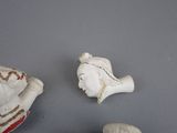 two figurines of a man and a woman on a table