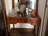 a wooden table with a mirror on top of it