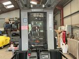 a fork lift truck parked in a warehouse with other equipment