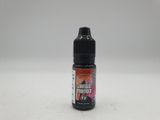 a bottle of liquid sitting on top of a white surface