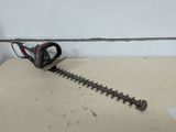 a close up of a hedger on a table next to a wall