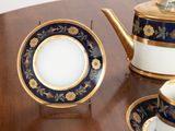 a tea pot and a tea cup on a table