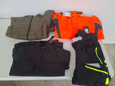 many different types of clothing laid out on a table