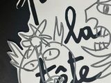 a picture of a sign with a drawing on it
