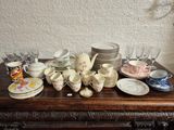 a table with a lot of dishes and cups on it