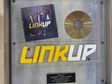 a framed picture of a cd and cd on a wall