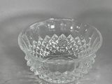 a clear glass bowl with a diamond design on it