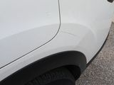 a close up of a car door handle with a sticker on it