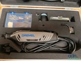 a box with a cord and a cord cutter in it