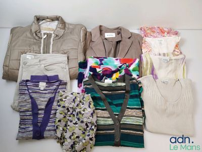 many different types of clothes laid out on a table
