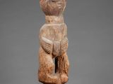 a statue of a woman holding a baby in her arms