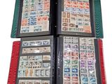 four different types of stamps in a binder on a white background