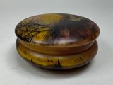 a picture of a wooden box with a painting on it