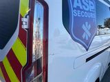 the back of a white van with a sticker on the side of it