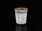 a cup that is sitting on a black table