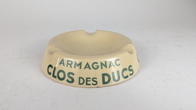 an image of a dog bowl with the words armagnac clos des ducs written on it