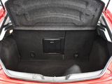 a trunk of a red car with its trunk open