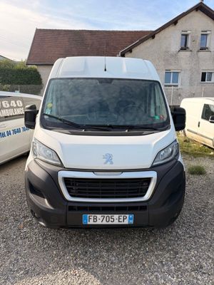 the white van is parked in front of a house