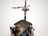 an image of a metal object with a cross on top of it