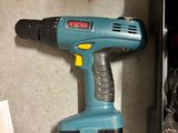 a cordless drill that is sitting on a counter