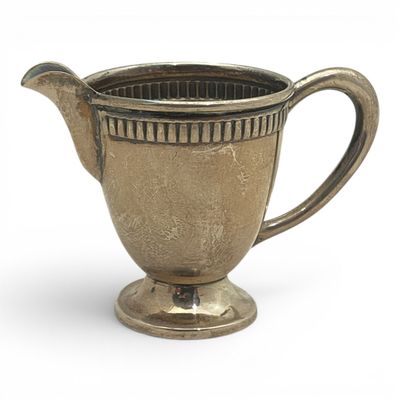 a silver cup with a handle on a white background
