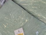 several towels are wrapped in plastic on a shelf in a store