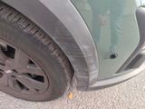 a close up of a car ' s tire on the street