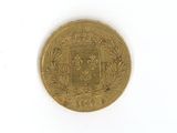 a gold coin with a coat of arms on it