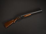 a rifle on a black background