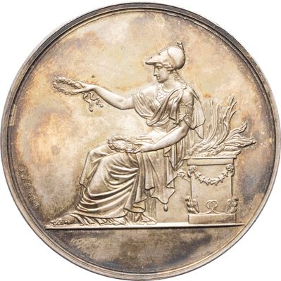 une image représentant une médaille d'argent sur laquelle figure une femme assise sur un banc