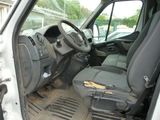 the interior of a van with the door open and the driver ' s seat down
