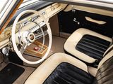 a view of a car ' s interior from the driver ' s seat
