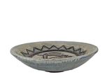 an image of a bowl with a fish design on it
