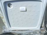 a white microwave sitting on top of a pallet