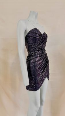 a close up of a mannequin wearing a purple dress on a mannequin