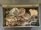 a box full of assorted items sitting on the floor