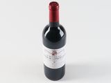a bottle of wine that is sitting on a table