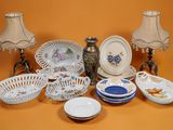 many different types of plates and bowls on the table