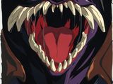 une image montrant un gros plan du visage d'un monstre à la grande bouche