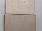two boxes that are stacked on top of each other