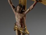statue of jesus on the cross on a gray background
