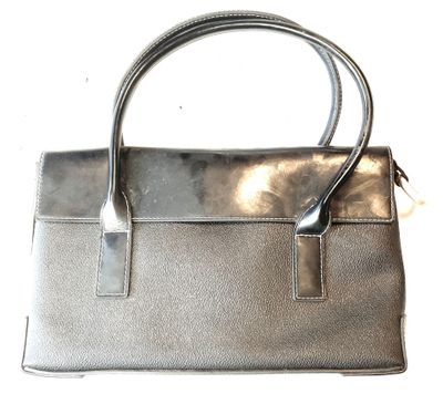 silver leather handbag on white background with silver handle