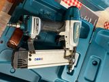 a blue box with a stapler and a stapler in it