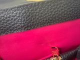 louis vuitton pink and black leather handbag with gold hardware
