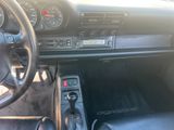 a car dashboard with a steering wheel and a dash board