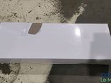 a white box sitting on the ground on the floor