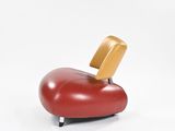 an image of a red chair with a wooden seat