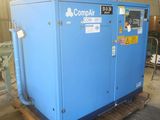 an image of a blue compressor sitting on top of a wooden pallet