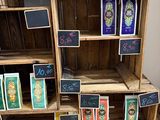 a wooden shelf with cards on it in a room