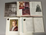 an open book with a picture of a man sitting in a chair